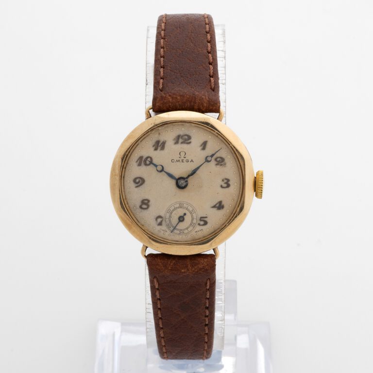 Omega 9k gold cased by Dennison